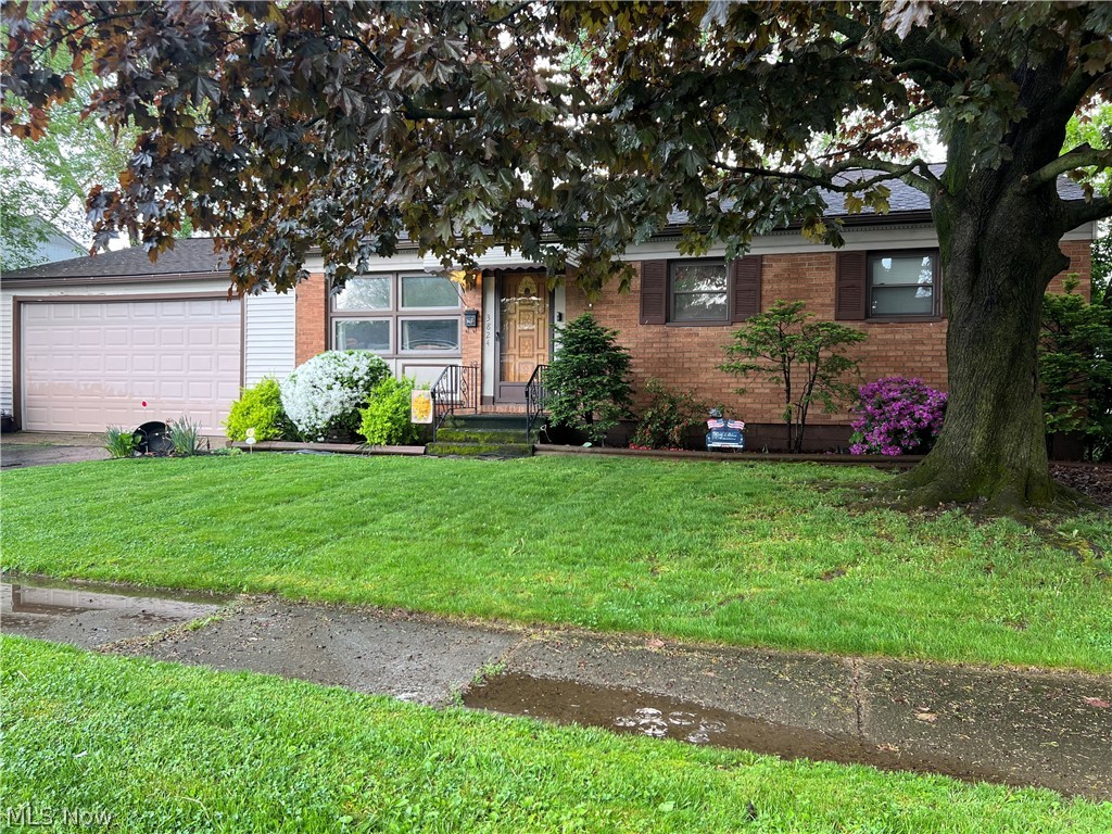Welcome to this charming brick ranch nestled in the heart of Plain Township, Canton, Ohio. Boasting a cozy ambiance and functional design, this three-bedroom, one-bathroom home offers comfortable living spaces and desirable features throughout. Step inside to find a bright and airy living room adorned with large windows, perfect for soaking in natural light. The adjacent kitchen is equipped with ample cabinet space and kitchen appliances providing the ideal setting for preparing delicious meals and hosting gatherings with family and friends. Three well-appointed bedrooms offer space for rest and relaxation, while the centrally located bathroom ensures convenience for all occupants. The remodeled bathroom features modern fixtures and finishes, adding a touch of luxury to your daily routine. Descend to the partially finished basement, where entertainment awaits. Gather with friends and family in the spacious recreation area complete with a bar, perfect for hosting game nights or cozy movie marathons. Step outside to your own private oasis, where a covered patio overlooks the expansive backyard. Relax and unwind in the serene outdoor space, complete with a fully fenced yard and a charming fire pit, ideal for enjoying starlit evenings and weekend barbecues. The oversized two-car garage provides ample parking and additional storage space, accommodating all your needs. Conveniently located in Plain Township, residents enjoy easy access to local parks, schools, shopping, highways and dining destinations, ensuring a lifestyle of convenience and comfort. Don't miss the opportunity to make this exceptional home yours and start creating memories that will last a lifetime!