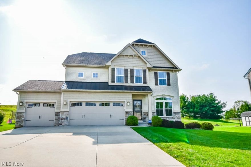 This open and airy 4 bedroom, 3.5 bath colonial in Saratoga Hills has everything your family needs! Just inside the front entry is a flex space that could continue to be an office or even a reading nook with lots of natural light from the transom-topped double window. Enjoy everyday living and entertaining with the open concept living room with a gas fireplace, kitchen with stainless steel appliances, center island with counter seating, and a sun-filled vaulted morning room. French doors lead to an inviting deck with views of farmland behind the home.  Upstairs are 4 bedrooms, 2 full baths, and a convenient 2nd floor laundry!  The owner's suite features a walk-in closet and en suite bath with double sink vanity, shower, and a garden tub!  Head to the lower level to gather for movie night in the rec room with access to another full bath. Outside, you'll appreciate the wide driveway that leads to the 3 car garage, and wonderful neighborhood with sidewalks, a community pool, and clubhouse