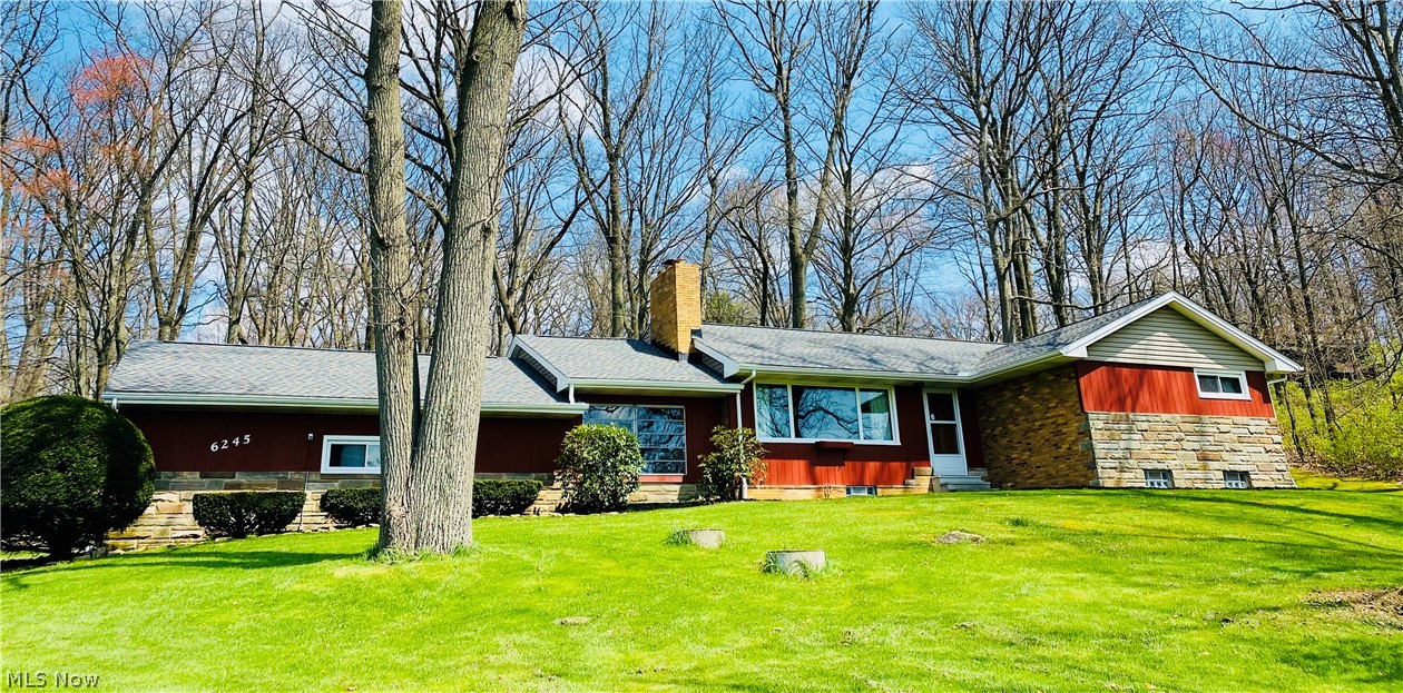 Nicely maintained 3 bedroom brick ranch home out of town on 1 acre. Living room with wood burner and large picture window boasting a great view! Open kitchen and dining area with ample counter space, custom cherry cabinets and appliances. Master bedroom with his and her closets. You will find plenty of closets and storage space through-out this home. The lower level has a workshop. There is additional square footage not listed in the lower level that would be a great space for that potential recreation room or man cave. Breezeway that leads to a 2 car attached garage with half bath. 2 car carport and a additional outbuilding with electric. Many good times to look forward to in the backyard space this home has to offer. New roof, windows, gutters, soffits, garage doors and carpeting in the last 3 years. Basement has had new footer drains installed and was waterproofed 3.5 years ago. New hot water tank 4 years ago. This will be a home you will want to put on your list too see!