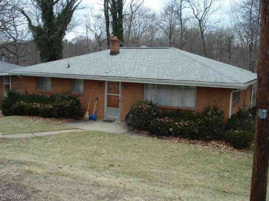 This well maintained 2 bedroom brick home has central air. A large deck is located out the dining room sliding door.  The roof was replaced in 2014. There is a 3/4 bath in the basement. The side lot goes with the house. The owner states that there is hardwood flooring under the carpeting.