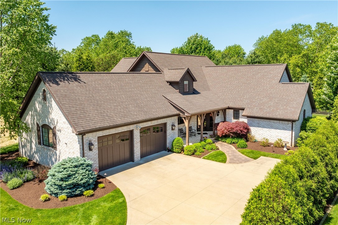 Step into luxury with this incredible Zablo custom-built home, uniquely situated on a quiet cul-de-sac in the Sanctuary neighborhood, boasting a clubhouse and pool. Experience unparalleled craftsmanship in this one-owner gem, featuring an expansive 2800+ sq. ft. of living space plus a finished basement. This exquisite home showcases an open floor plan that’s perfect for entertaining. Attention to detail is seen in the hand made jumbo brick, stunning woodwork, hickory harwood, beamed ceilings, and custom finishes throughout the home. The master bedroom is located on the main floor with an incredible bath and a spectacular custom walk-in closet. The second story offers a versatile two-bedroom setup with an additional loft space, ideal for a home office or cozy reading nook. Dive into comfort in the sizable finished lower level which includes a third full bath. Enjoy privacy in a peaceful, partially fenced-in lot that backs up to scenic views, providing a relaxing oasis just steps from your door. Located in the vibrant community of North Canton, this home is not just a residence, but a lifestyle. With quick access to community amenities, Stark Park trails, a pool, and the neighborhood clubhouse! Every day will feel like a vacation in this spectacular home. Highlights include: -Pella Windows -whole house generator -irrigation system for yard and beds -central vacuum -reverse osmosis -large walk-in cedar closet on the lower level.