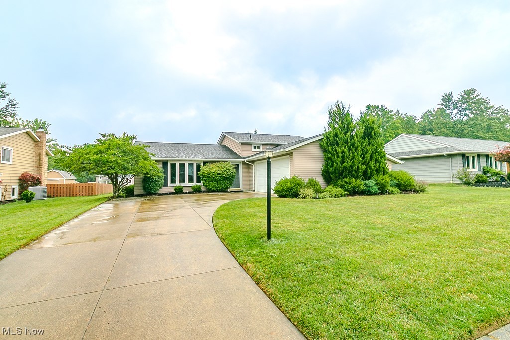 You will be hard pressed to find another property that has been cared for and loved as this beautifully kept split level in one of Strongsville's sought after developments. Every area of the home both inside and out has been carefully paid attention to over the years leaving nothing left for you to do other than move in and enjoy this amazing property. Pulling in, notice the meticulously kept lawn, landscaping, and exterior of the home. The roof and gutter systems were professionally installed in 2015, a quality update that adds to the home’s appeal. The backyard offers plenty of space for the family to play and entertain with a stamped patio perfect for the BBQ and patio set up. Through the front door and to the left is the oversized living room offering plenty of space for the whole family to spread out and enjoy. Flowing to the right is the dedicated dining area perfect for those large family get togethers and entertaining. Into the eat in kitchen you will find every area has been perfectly kept to it's original charm. Notice the convenient sliding doors allowing access to the back patio! Up the steps are three perfectly sized bedrooms and a spotless full bath. The partially finished basement offers even more functional space with a full bath and beautiful brick accent wall boasting a wood burning fireplace perfect for enjoying in the colder months. Both the interior and exterior of this property were professionally painted. Furnace, heat pump, and central air were just replaced 23'. There truly is nothing left to do here but unpack and start living! Schedule your private showing today!