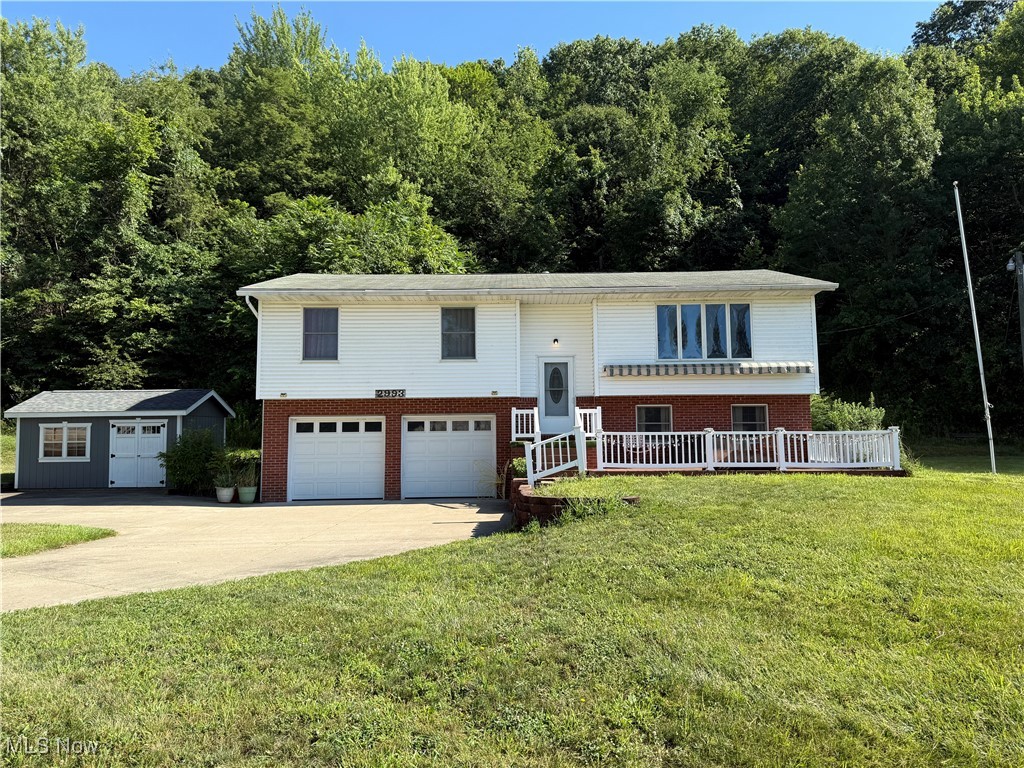 Beautiful 3-bedroom 2-bath bi-level home with an attached 2-car garage sitting back on 1.251 acres of land outside of town. Additional living area, full bath, and laundry room on the main floor. Open concept kitchen, dining room, and living room. There is a raised deck off of the dining room and an additional deck out front equipped with a retractable awning. Roof replaced and Leaf Guard Gutters installed in 2020. Shed purchased in 2022. New Furnace in 2023.