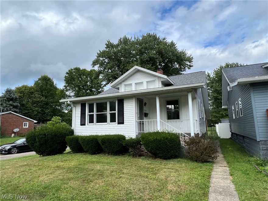 Neat & clean and ready for new owner! Freshly painted with new flooring.  Sitting on a nice corner lot, this home offers 2 on the main level, full bathroom main level, huge living room, dining room and kitchen. Full basement. Potential 3rd bedroom on second floor. New roof last 2020. Attached 20x24 carport off the back and a large backyard. Convenient location close to stadium, waterpark and other amenities. May require flood insurance.