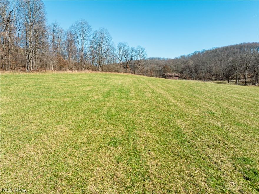 LIVE AUCTION SATURDAY APRIL 25TH! Equipment at 10am * Real Estate at 12 noon. Parcel 13: 21.0 +/- acres w/ 1318’ frontage. Wooded hunting tract
85 Acres • 5 Parcels • Hilltop Views
Discover 85+/- acres offered in five parcels featuring hilltop building sites, excellent hunting ground, pond, fenced pasture, and two barns. A perfect mix of open land and woods—ideal for homesites, recreation, hobby farming, or investment.
Parcel 13: 21.0 +/- acres w/ 1318’ frontage. Wooded hunting tract
