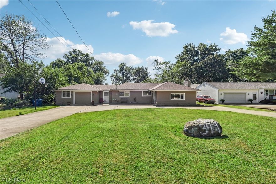 This charming 2-bedroom, 2-bathroom ranch-style residence is nestled on a generous 0.8-acre lot, offering an abundance of space and privacy. The moment you arrive, you'll be greeted by a convenient circular driveway leading to an attached 1.5-car garage, ensuring ample parking and storage. Step inside to discover a spacious living room, where a stunning stone fireplace creates a cozy and inviting atmosphere, perfect for relaxing evenings with family and friends. The home's character shines through with unique architectural details and thoughtful touches throughout. The kitchen is a chef's delight, featuring plenty of storage and counter space to accommodate all your culinary needs.  Venture outside to find a serene backyard oasis, complete with a charming patio and a beautifully maintained garden area. This outdoor space is ideal for al fresco dining, gardening, or simply unwinding 
while taking in the peaceful surroundings. Plus, enjoy the excitement of Howland Tiger football games right from your backyard!
Conveniently located close to area shopping, restaurants, and major highways, this home offers the perfect balance of tranquility and accessibility. With its desirable ranch layout, expansive lot, and delightful features, this home provides a perfect blend of comfort, convenience, and character.
Don’t miss the opportunity to make this your own personal retreat!