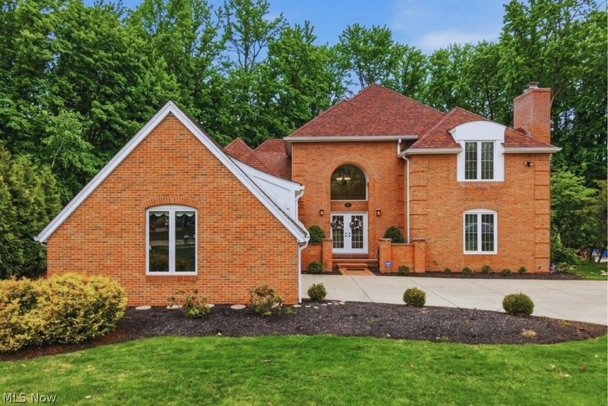 Rare All-Brick Colonial home located on a private cul-de-sac in the highly desirable Lakes of Aurora. This meticulously maintained 4-bedroom, 4-bath home offers Elegance, Functionality, and Timeless Design with 9 ft. ceilings and hardwood floors throughout the first floor. As you enter, you are welcomed by impressive double doors leading into a grand two-story foyer featuring a timeless staircase design that sets the tone for the elegance throughout the home. Stylish interior French doors off the living room offer the perfect balance of privacy and openness, close them for quiet separation or open them to enhance the home’s open flow when entertaining. A newer gas fireplace with remote control adds a cozy touch. The spacious kitchen is designed to impress with cherry cabinetry, new Quartz countertops, high-end Viking dishwasher, 6-burner gas stove with a dual-motor stainless-steel chimney, double convection ovens, wine cooler, and a charming breakfast nook. A conveniently located half-bath and first-floor laundry adds to the everyday practicality and ease. The first-floor primary suite is a true retreat, offering a private deck, a spa-inspired bath, new quartz countertops and fixtures, a relaxing jetted soaking tub, and a spacious walk-in closet. An adjoining private office or flex space with a premium gas fireplace installed 2023 add comfort. Upstairs features three spacious bedrooms including a Jack-and-Jill bath. The finished lower level offers a spacious entertaining room with a half-bath, a fitness area and abundant storage. Outdoor living is unmatched featuring an expansive deck restored in 2025 overlooking a private wooded park-like setting on .63 acres. Enjoy all the amenities the Lakes of Aurora has to offer, including two pools, tennis courts, clubhouse, walking trails, gym, playground, lakes, and annual community events. Nothing to do but move right in and enjoy luxury living in a splendid home in one of Aurora’s most sought-after communities.