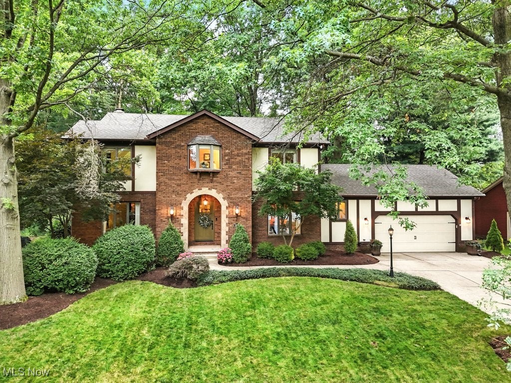 Wow a true treasure of love and pride. This stunning 4-bedroom, 2.5 bath with a finished basement, Tudor-style home blends timeless character with thoughtful modern updates throughout. The custom kitchen is a chef's dream, featuring granite countertops, a subway tile backsplash, double ovens, a gas stove in the middle of the spacious island, and a stainless steel refrigerator and dishwasher. The main level showcases beautiful bamboo flooring, wider baseboards, elegant French Doors, and a custom mudroom with a built-in bench and shelving, keeps everything organized as you enter the house and also adds timeless charm. The open concept Family Room with a gorgeous fireplace that has been redesigned with beautiful wood framing around the brick and an updated mantel.. flows seamlessly into the kitchen and spacious eating area. There are sliding doors leading to a deck to discover a beautifully landscaped backyard on a spacious lot. Enjoy evenings in your private gazebo.. completely rain and mosquito free while soaking up mother nature's beauty, plus there is a basketball hoop and court in the backyard offering fun for all ages.
The landscape and lighting is fabulous from front to back.
Upstairs you find new plush carpet on the 2nd floor, solid bamboo flooring on the first level 2020, custom drapes and blinds(updated approx 5 yrs ago). The finished basement provides additional living space, featuring newer carpet (installed approx 3 yrs ago), and was professionally waterproofed by Ohio State Waterproofing in 2021 (renewal of the waterproofing is approx $75 per year). Exterior updates include roof shingles (approx 2016), garage & entry doors (approx 3 yrs ago), a newer front door, and attractive landscape lighting for added curb appeal.
Dates are approximate and not guaranteed. Buyer to verify all information.
