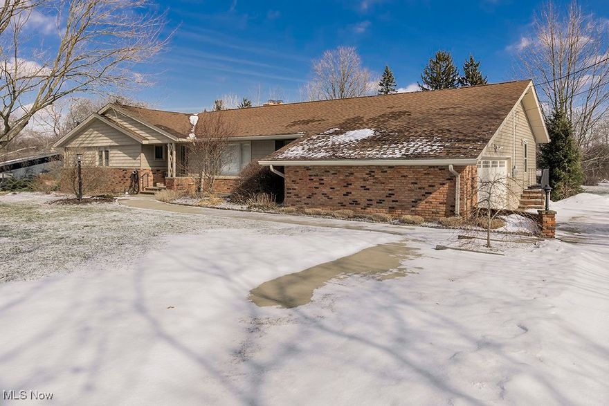 This sprawling mid-century ranch home is set on just under 2 acres on a sought after street. Updated kitchen with Maple cabinets, granite counters & stainless steel appliances. Built in desk, perfect for a work space or cozy spot to plan your cooking adventures. 
Great room with parquet floors & a vaulted ceiling & fireplace…wall of sliding doors looks out to a fabulous screened in porch.
Spacious Living room opens to dining room.  Master suite with private bathroom, 2 other bedrooms share a full bath. Laundry room, Utility room, cedar closet and half bath conveniently off of the kitchen.  Enjoy the tranquility of the large yard from the screened porch or patio. Rare find. Don’t miss this exceptional home.