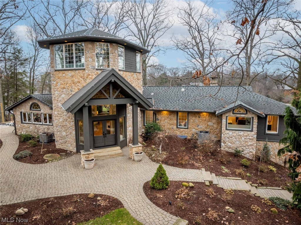 Welcome to the Lake Cable home of your dreams! Nestled on a treed 1.34 acre lot on the highest point on the lake, this beauty boasts 4-5 bedrooms, 3.5 baths and approximately 6,000 total sqft of quality living space. The home was recently remodeled and updated throughout under the guidance of a professional designer to best capture water views while honoring the old-growth oaks surrounding the home. A spacious two-story foyer welcomes guests while serving as flex space. Leading from the foyer is a staircase to the tower which provides stunning 360-degree views, perfect for a home office and multi-purpose room. The custom built kitchen is bright and thoughtfully crafted with an oversized moveable island, upscale appliances, and a fabulous open pantry. Adjacent to the kitchen is the great room with oversized windows designed to capture sweeping lake views. Two secondary bedrooms on the main floor provide exceptional lake views while the spacious master bedroom, also with beautiful views of Cable Bay, has a fireplace, private glass-paneled balcony, large remodeled bathroom with heated floor & two generous walk-in closets. A well-designed laundry room, oversized bathroom, and charming powder room complete the main level. The walkout lower provides a spacious family room with fireplace, second full kitchen, a large bedroom with bath, bonus room (or 5th bedroom), secondary laundry area, sauna, and storage hidden behind sleek Scandinavian-inspired doors. Leading to the garage is a mudroom drop zone with built-in storage lockers. Outdoors you’ll find multiple brick & flagstone patios, and composite decking with walkways to the double dock on over 250’ of waterfront. Beautiful professional landscaping and mature trees surround this private retreat. This home is a rare find in which all the work is done -- all you need to do is move in and start enjoying your new lake life!
Take a virtual tour at: https://www.youtube.com/watch?v=lmtY35rJ69Q