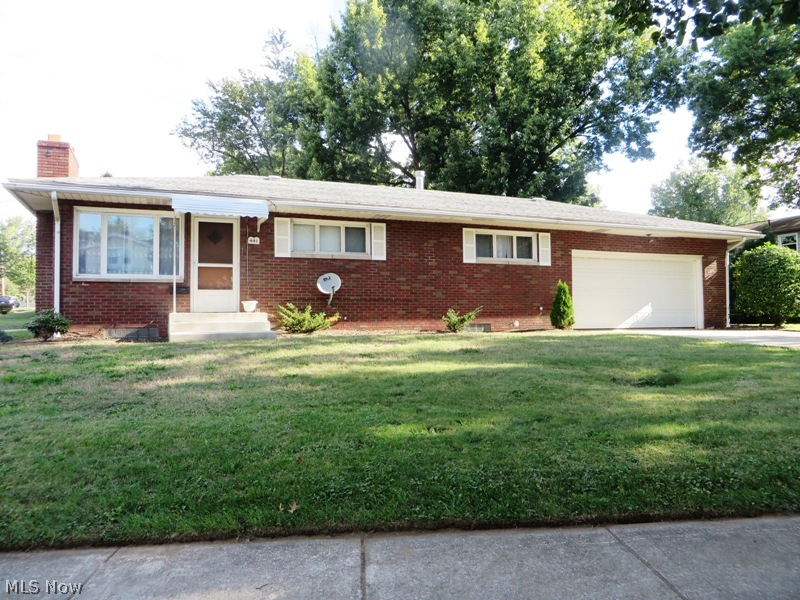 What a find in this 3 bedroom 2 full bath all Brick Ranch! You will love all of the updates and open concept of this home. Completely new kitchen with ceramic tile flooring, new cabinets, counter tops, tile back splash, brand new appliances and light fixtures! Kitchen is open with a bright breakfast nook and center island with breakfast bar! All new carpet on first floor. Updated baths and partially finished basement with rec room and additional living space with fireplace and second bath. Attached 2 car garage, two paved drive ways and large corner lot. One floor living at it's finest!