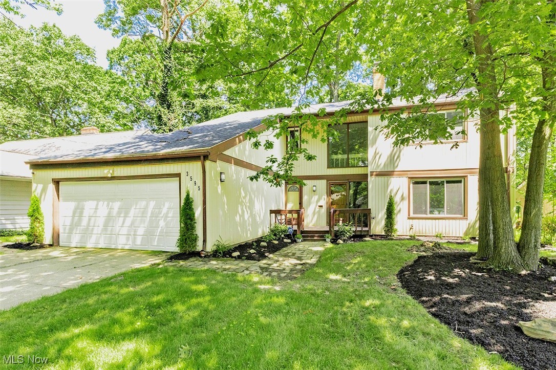 A beautiful, well maintained and updated Cleveland Heights home. Greeted by a welcoming foyer (where you'll find access to the first floor half bath and laundry with new washer/dryer 2023) leading to an open floor plan on the first floor between the family room, kitchen, dining and living rooms. Beautiful new kitchen with all new stainless steel appliances in 2023 including a gas stove, granite countertops, fresh white cabinetry and subway tile backsplash. Generous living space on the first floor with a formal living room complete with a brick, gas fireplace and a family room with beamed ceiling and amazing dual sliding doors that lead out to the deck. The second floor has four generous bedrooms including a primary suite complete with built-in closets and a private full bathroom. Another common full bathroom is off the upstairs hall; all bathrooms are updated with new vanities, fixtures and a bright fresh pallet. The basement is nicely finished with a great room and bonus room and has been fully waterproofed with new block windows. Great storage room with an additional 400 square feet of space (not included in the total). This home has luxury vinyl plank flooring throughout and has been made very efficient with newer windows, new furnace and air conditioner, a new roof and gutter guards, along with a new hot water heater and exhaust chimney liner. Enjoy the outdoors from the spacious deck complete with a gas line for easy grilling and privacy of the full, newly fenced backyard or relax on the front porch and visit with neighbors. Attached two car garage with a new door opener and springs is a nice feature of this property. Conveniently located with easy access to restaurants, retail, local schools/ universities, hospitals and just a short distance from downtown for a quick commute.