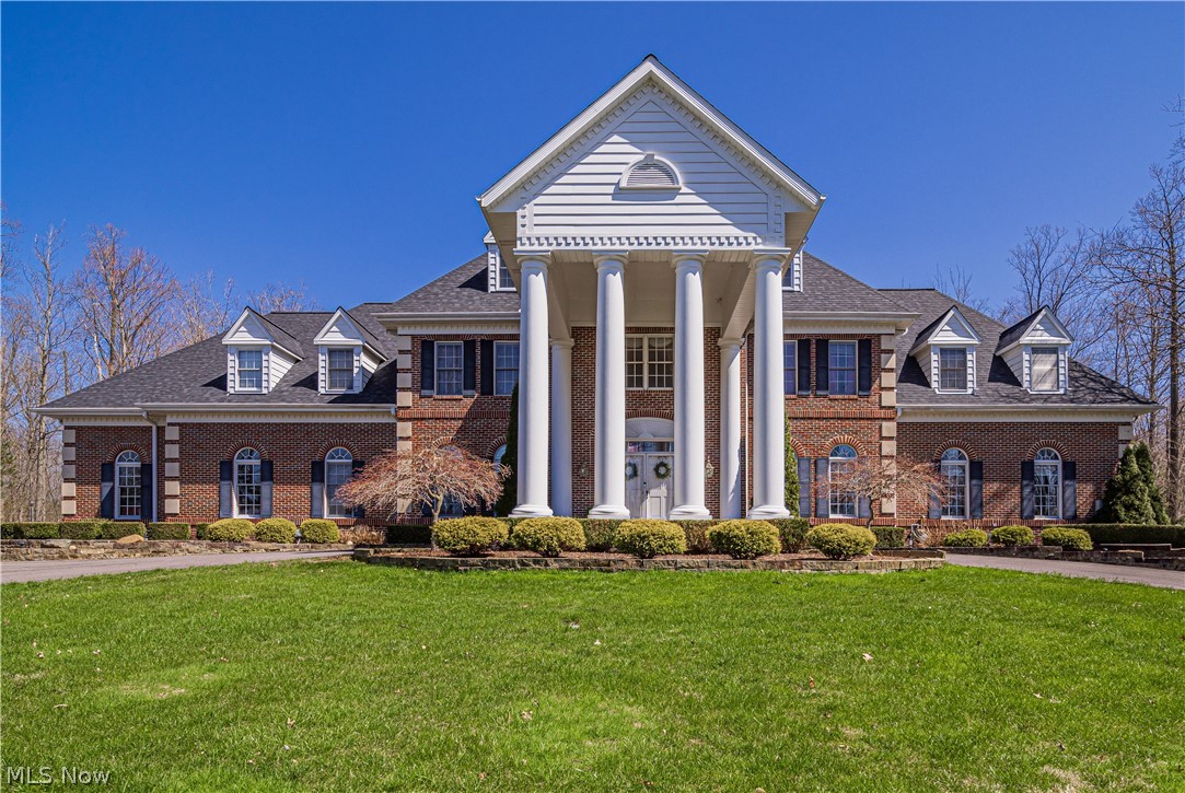 This stately ALL brick pillared Georgian manor is situated on a spectacular 3 acre gated lot offering complete privacy and security. This extraordinary grand home is loaded with updates and every amenity imaginable. Enter the grand foyer with magnificent duel staircases and opens into the impressive great room with custom wet bar, 23 foot ceilings with walls of floor to ceiling windows and a majestic brick fireplace. The massive renovated in 2019 chefs dream kitchen has a 20 foot wall of windows new antiqued cabinets & features a 12 foot island with exquisite granite, indoor grill, professional hood, Viking cooktop and Frigidaire Professional fridge. There is a gorgeous 3 season room off the kitchen with hot tub and leads to the stunning back yard with a inground salt water pool with automatic cover gorgeous deck with built in gazebo. Additional highlights of the first floor are dining rm, library, a separate office/den, & laundry with dog wash bay. The master suite is features a separate sitting rm, dressing area with vanity, his & hers closets, & a stunning glamour bath with built in frplc. Three additional bedrooms one with a private bath & 2 have Jack & Jill bath. The third level has 2 more bedroom & another full bath. The newly renovated walk out basement has a wet bar, all led Lumitron lighting, work out rm w/ sauna, & another newly added full bath. This spectacular home also has a new in 2021 40x30 dethatched garage & is 5 minutes to the Falls & 10 min to 271 WOW!
