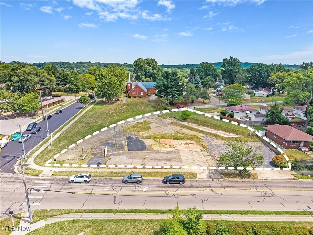 Prime 0.75-acre development site available at the signalized corner of Brittain Road and Eastwood Avenue in Akron, Ohio. Featuring approximately 200 feet of prominent frontage along Brittain Road, this property offers unmatched visibility and accessibility in a high-traffic retail corridor.
The site is zoned for commercial development and is ideally suited for retail, QSR, or service-oriented users seeking a strategic location just 2.8 miles from the University of Akron, which serves over 15,000 students.? Surrounded by dense residential neighborhoods and established retail, the location benefits from consistent traffic and strong demographics.
With flexible sale or ground lease options, this property represents a rare opportunity for tenants, developers, or investors to secure a high-exposure corner in a growing submarket.
Key Highlights
0.75 Acres available – for Sale or Ground Lease
Signalized hard corner at Brittain Rd. & Eastwood Ave.
±200 feet of frontage on Brittain Road
High visibility retail corridor with 13,138+ VPD
Zoned Commercial Development
2.8 miles from University of Akron (15,000+ students)
Strong surrounding demographics:
1 Mile Population: 10,362
3 Mile Population: 87,909
5 Mile Population: 208,890
Avg. Household Income: $65K – $73K
