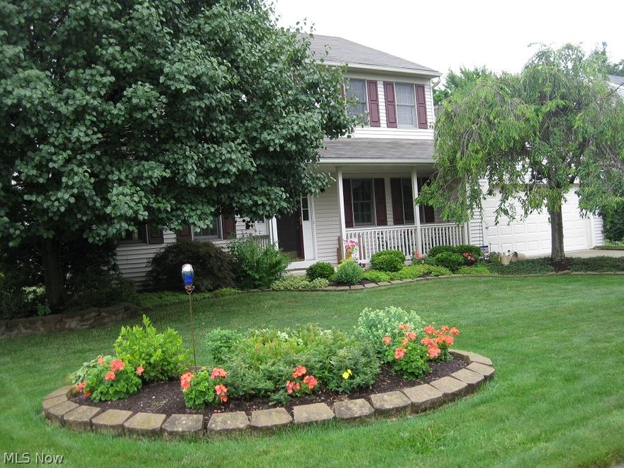 This beautifully landscaped and well maintained colonial is situated on a quiet cul-de-sac street and conveniently located close to freeways & shopping. Enjoy the quaint front porch, French doors separating the living room & family room. The spacious eat-in kitchen has the center isle, numerous cabinets & pantry, sliding glass door to nicely treed back yard, and open view into the family room with its warm and inviting fireplace. All the bedrooms have walk-in closets. Nicely finished basement, plus office and much storage space. Other special amenities include additional 14x12 garage space that could store a boat or other special possessions. There is a central vac system throughout home and a security system.