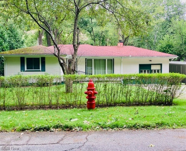 Are you looking for a place on the Chagrin River where you can birdwatch amongst nature? Watch the Bald Eagle soar along the river looking for his next catch? Enjoy all that nature has to offer? This lovely little Ranch just may be for you! 3 bedrooms, living room, eat in kitchen, and family room all on one floor. The laundry, the half bath, and the mechanicals are just a few steps down in the heated attached garage. Current owners used this area as more of a workshop and used the attached carport to park in. A little over a half acre, but feels like more as it is so private and tranquil. Not a through street so traffic is confined to those who live there. Bring your decorating ideas and make this home for you! City water. Septic installed 2001. Last inspected August 2023. Roof 2012. Hot water tank and leaf fitter for gutters 2014. Large front window replaced 2017. Some other newer windows as well. Bath vanity, mirror and light replaced 2020. Hardwood floors in most of the home. Schedule your private showing today!