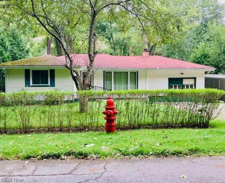 Are you looking for a place on the Chagrin River where you can birdwatch amongst nature? Watch the Bald Eagle soar along the river looking for his next catch? Enjoy all that nature has to offer? This lovely little Ranch just may be for you! 3 bedrooms, living room, eat in kitchen, and family room all on one floor. The laundry, the half bath, and the mechanicals are just a few steps down in the heated attached garage. Current owners used this area as more of a workshop and used the attached carport to park in. A little over a half acre, but feels like more as it is so private and tranquil. Not a through street so traffic is confined to those who live there. Bring your decorating ideas and make this home for you!  City water. Septic installed 2001.  Last inspected August 2023. Roof 2012. Hot water tank and leaf fitter for gutters 2014. Large front window replaced 2017. Some other newer windows as well. Bath vanity, mirror and light replaced 2020.  Hardwood floors in most of the home. Sch