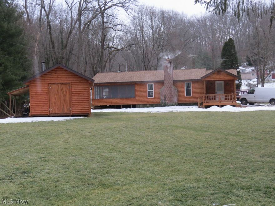 Amazing, Totally Remodeled Cabin at Leesville Lake!
 Beautiful 1 story log sided 2 bedroom, 3/4 bath home with large living room w/ stone fireplace w/ insert, new hickory kitchen w/ new appliances, laundry room w/ new appliances and water softener. Enjoy the lake view from the new 8'x16' screened porch and open porch too! Also included is a new log 14'x18' cabin/ workshop with covered porch. This bldg. is insulated and has electric and wood burning stove. The lot is level and situated next to a babbling brook and is an approx. 400' walk to the boat docks. Home has all new shingles, windows, electrical, plumbing, and has been totally insulated. All minerals owned transfer subject to current lease. This is a wonderful property that must be seen! Property is subject to deed restrictions and MWCD flood easement. This property is dock eligible.  Initial HOA fee is $125 and yearly after that. MWCD boat sticker is $220 per yr. Call to view this gem!