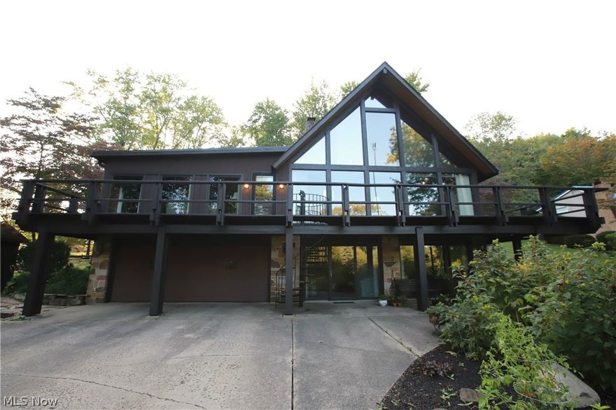 Start the new year in this exciting community! This unique, beautiful home, situated at Sevakeen Country Club, makes every day feel like a vacation. Tall, peaked ceilings, spacious, open floor plan, and an over abundance of natural light - It's all there! A towering stone fireplace conceals the staircase to a cozy master bedroom, with en-suite bathroom and beautiful views. The family room/sunroom and the three bedrooms all feature large windows. The lower level family room features a timeless, brick fireplace and well-built bar, perfect for entertaining. The resort feel continues outside with over 1000 ft2 of balcony and deck! The outside space includes views of the woods, easy access to two storage sheds, and a decorative bridge. All of this close to swimming, tennis courts, playgrounds, fishing, basketball courts, the clubhouse, and a public golf course! Home includes quality kitchen appliances, newer water filtration system, cleaned carpets, and a fresh coat of exterior paint. Furnace was installed last winter. The property sits on leased land (financing requires at least 20 % down) with annual lease of $890 and annual HOA Fee of $388.51, which includes trash removal and all country club amenities. Visit www.Sevakeen.com for more info and events. Reduced to $159,900 with Realty Home Pride. Seller is related to agent.