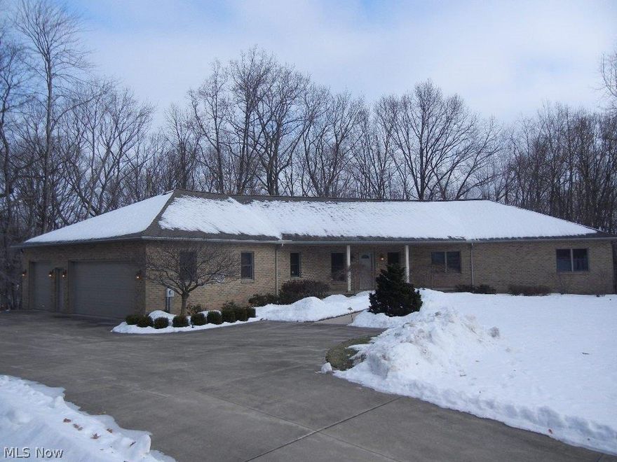 Quality "Brick" ranch situated on a private Cul de Sac offering a wooded park like setting.  Wide open floor plan featuring a gourmet's kitchen with built ins and 10 ft center isle, bayed dinette with ravine views, great room with fireplace, sun room with patio and porch access, master bedroom suite with lavish bath, full basement with walk out, 35x33 hobby garage.  Very Clean!!