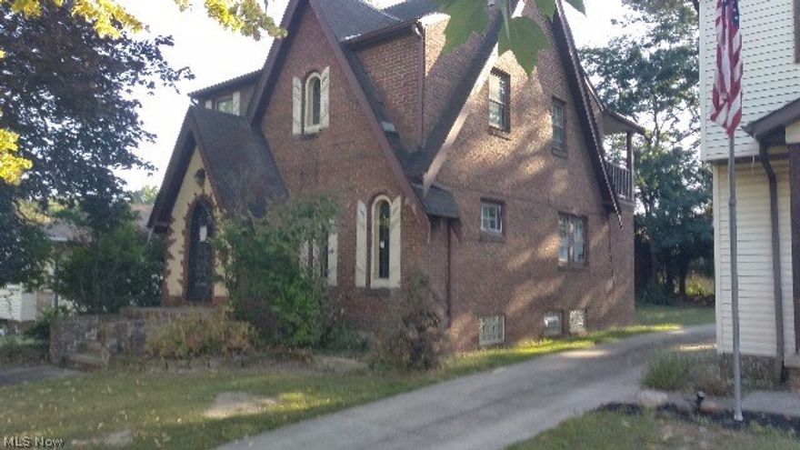 Brick Tudor with lots of character.  Brick interior and many features that must be seen.  Three bedrooms, 2.5 baths, unfinished basement with two car detached
 garage.  Hardwood floors throughout just waiting for your personal touch to make this house your  home.