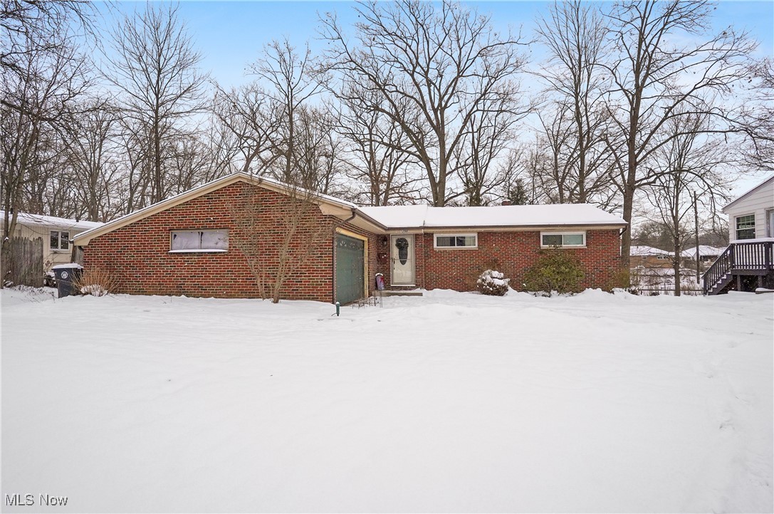 WELCOME to this adorable WEST AKRON ranch home. As you enter, you are greeted with a very large living room, featuring hardwood floors and a big bay window. The dining room has sliders that open up directly to a roomy deck, perfect for entertaining and/or relaxing. The lengthy galley kitchen has plenty of countertop and cabinet space, as well as, an eat in kitchen. There are 3 sizeable bedrooms all with significant closets in each room. The fully UPDATED bath has double sinks!!!! The very large finished Rec room in the basement provides endless possibilities....including a bonus room!!! The backyard is very private and peaceful with a wooded like feel to it. This one is a must see. Close to so many amenities.