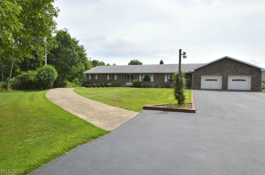 Quality abounds this extremely spacious all brick ranch on almost 2.5 acres that sits over 200 feet from the street.  The main level of this home plays host to an updated kitchen with island, formal dining room, living room, family room with brick fireplace, a laundry room, a foyer, a full bath with double sinks, and three large bedrooms including a master with an additional full bath.  A gigantic basement provides ample storage.  Exterior features include a 2 car attached garage, enclosed three seasons room, patio, deck, and a driveway that leads to a 30 x 58 outbuilding with drive in door, electric, gas, and half bath.  Furnace is 3 years old, A/C is 2 years old, roof approx 10 yrs old, and gutters are 3 years old.  Call today!!