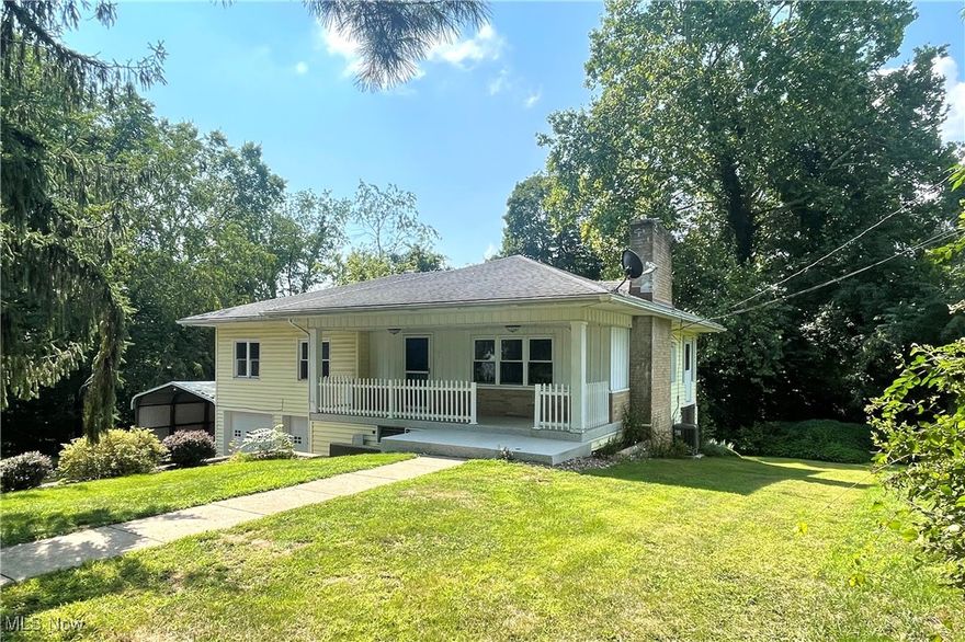 A Long List of updates comes with this adorable 3BR-2BA ranch on .7 acre, tucked in well off the street for privacy, in a quiet area of Millersburg!  From the circular drive, approach the covered front porch, perfect for relaxing and you will enter the nice sized, charmingly re-done living room with a fireplace.  This opens to the dining area with a wall of built in cupboards and leads to the enclosed upper porch.  Head back in and you will be greeted by the beautiful kitchen, with all new cabinets, quartz countertops, and stainless-steel appliances which remain with the property.  In the hallway off the kitchen is a pantry closet for great storage.  The bathroom underwent the same transformation as the kitchen, all new!  The 3 bedrooms with the original hardwood floors feature wood ceilings, updated light fixtures and all have ample closets with pocket doors. From the kitchen, head down to the basement with windows for lots of natural light, which contains the laundry area and lends itself well to some additional flex space. You can walk out the lower level from the laundry and enjoy the covered patio below the enclosed porch above.  The second bathroom is in the basement. The basement also walks into the oversized 2 car garage with plenty of room for a workshop area.  There is also a detached carport and the owner receives some income from royalties, which will transfer to the new owner.  Convenient location,  Many Updates, move-in ready, charming, and awaiting a new owner!