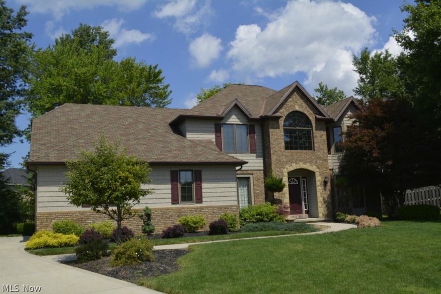 Stunning Custom-Built Home on Quiet Cul-de-sac Street in Foxwood Estates!  Impressive Four (4) Bedroom Favorite with Spectacular 1st floor Kitchen that is wide open to a breathtaking Hearth/Great Room with Vaulted Ceiling, Skylights, Stone Fireplace, Custom Windows and Two (2) Large Custom Built-In Window Seats to overlook a Large and Inviting back yard!  Enjoy a Custom Upgraded Kitchen with raised paneled cabinets, Granite back splash, 18' Travertine Tile Floor, and Newer Upscale Appliances!  Off of the Kitchen Dining area is a wonderful Two-Story Family room with Skylights, Custom Built-In Cabinets and stairs that go up to a family-friendly play loft.  Not your typical 4-Bdrm Colonial ...lots of meaningful upgrades and spectacular improvements that make this one of the most desirable values in North Royalton!  Check out the private yard with stamp concrete patio AND deck with two convenient exits from your hearth/great room addition ...super for entertaining or for Family Fun. Let's