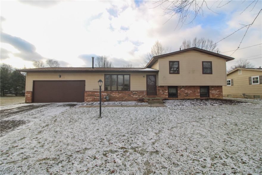 Welcome to 433 Springdale in Salem, a four level split tucked at the end of a dead end street on a spacious half acre lot. This home offers a smart layout, solid updates, and room to grow into your own style.
The main living room is bright and comfortable with large front windows that bring in natural light. Just off the kitchen, the dining area features sliding glass doors that open to the rear deck, making everyday living and entertaining feel easy and connected. The kitchen offers ample cabinet space, generous counters, and a functional layout ready to enjoy as is or update over time.
Upstairs are three bedrooms and a full bath, all well sized and filled with natural light. The lower level adds a second living space centered around a full brick fireplace, perfect for relaxing or gathering. The laundry area is located on this level and is already plumbed for a future additional bathroom. The lowest level provides excellent storage or potential finishing space. A newer roof, updated electric panel and furnace offer peace of mind, while the attached two car garage adds everyday convenience. The backyard provides plenty of room to enjoy the privacy and quiet of this peaceful setting. This is a home with good bones, flexible space, and the kind of potential that makes it easy to picture what comes next.