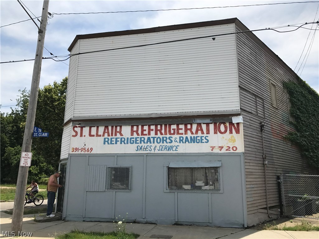 Corner store front with a 2 bedroom apartment above. 1 car detached garage. AS-IS