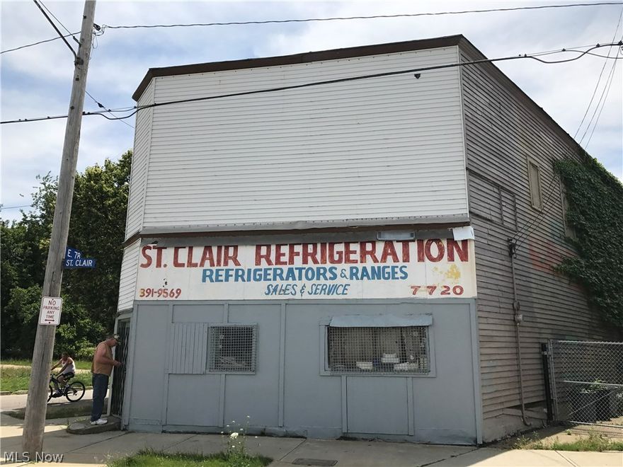Corner store front with a 2 bedroom apartment above.  1 car detached garage.  AS-IS