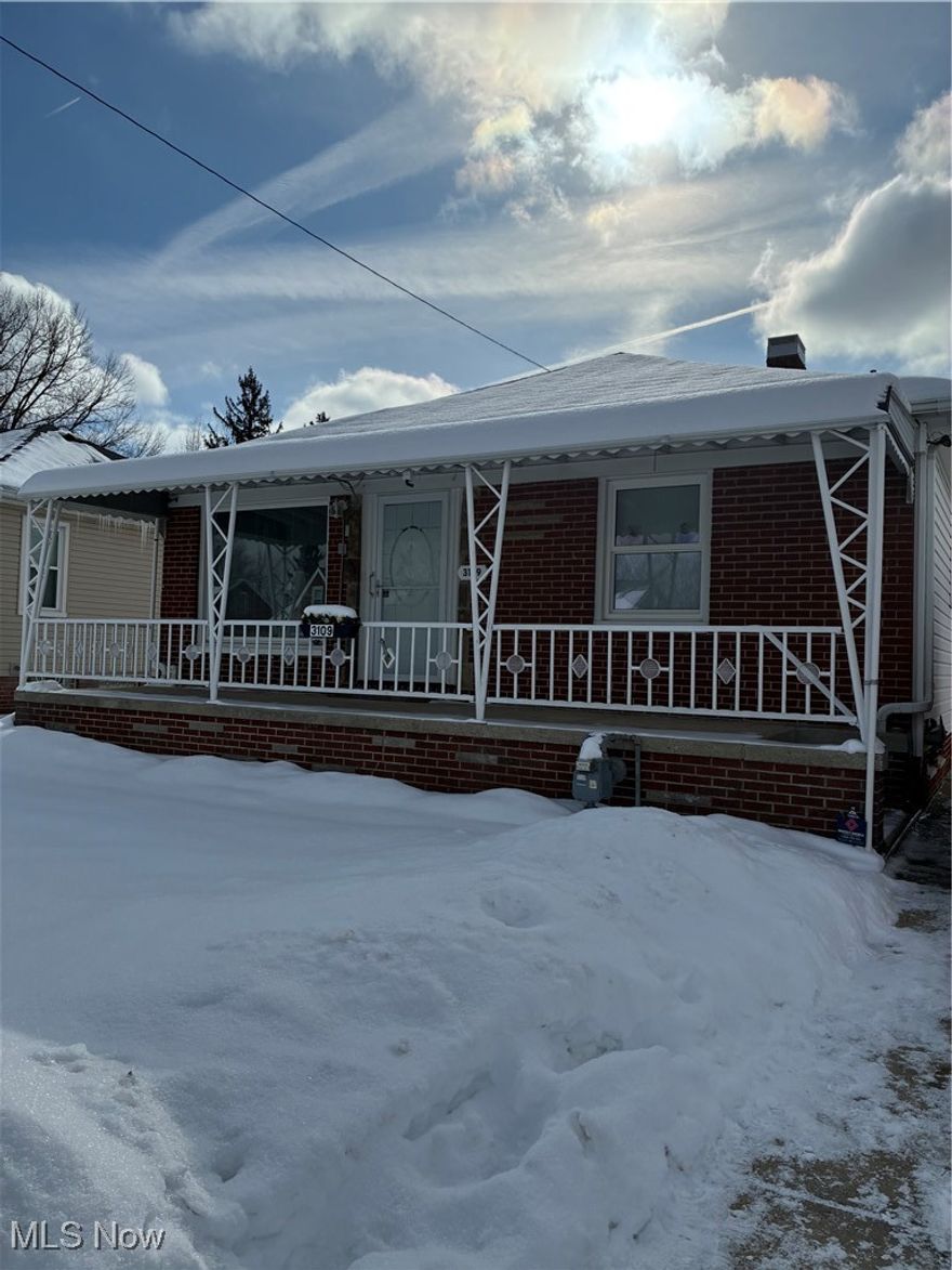 This impeccably maintained brick and vinyl ranch home offers the best of one floor living. Inviting full front porch leads into a large, light filled living room. Formal dining room with built-in cabinetry open to the spacious kitchen with breakfast bar, ample kitchen cabinets and plenty of counter space. All appliances included: range, refrigerator, microwave, and dishwasher. Newer laminate flooring. Recently updated bath with walk-in shower. The three bedrooms featuring hardwood floors and ceiling fans.  Finished basement with rec room, laundry and full bath with stainless steel stand up shower. Updated electric, high efficiency furnace and central air. Fully fenced yard. Extra large two car garage and shed. This home is in excellent condition and ready for your decorating ideas.