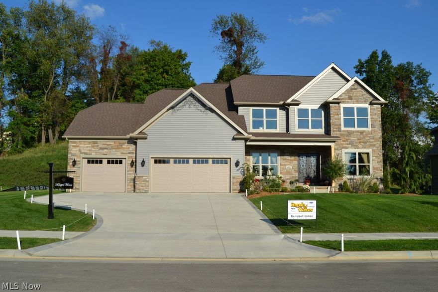 Stunning 2014 Parade of Homes, New Construction, stone/vinyl colonial built by Kemppel homes.  This 5 Star Rated Energy Efficient home features top of the line finishes & amenities. Enter through Trento double wrought iron front door into dramatic 2 story foyer. Adjoining living room w/ coffered ceiling & formal dining room w/ curved trey ceiling.  Spectacular kitchen features custom, raised panel Maple cabinetry, expansive 9 foot center island w/ seating for 6, Silestone quartz countertops, SS appliances & cozy dinette. Flagstone/barn-stone patio just steps away.  Kitchen open to Great Room w/ impressive gas fireplace w/ French Country Crown.  Mudroom w/ storage cubicles & first floor laundry off garage. The master suite is an owner's private oasis w/ electric see thru fireplace, sitting area & 16x8 walk-in closet. Spa-like master bath includes H/H vanities, Quartz countertops, soaking tub & shower with dual heads & frameless door. Three additional bedrooms including one with en-suite