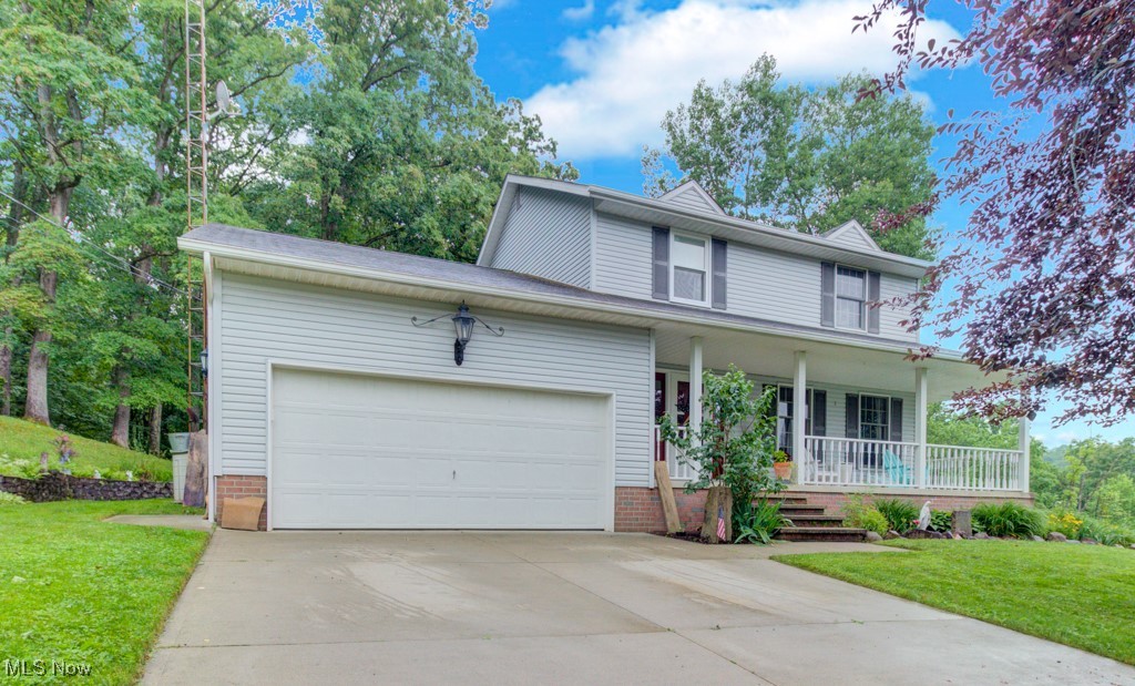 Welcome to this beautifully updated home nestled on a serene wooded lot in the gated Lake Mohawk community! This spacious 3-bedroom, 2.5-bath home offers charm, functionality, and room to grow. Enjoy the versatile bonus room off the kitchen that opens to a cozy, covered front porch — perfect for morning coffee or relaxing evenings. The kitchen features durable industrial vinyl flooring, newer Corian countertops, and flows seamlessly into the family room with a gas log fireplace. Step outside to a private back deck surrounded by nature — ideal for entertaining or quiet retreats. A formal living room and convenient half bath complete the main level. Upstairs, you’ll find three generous bedrooms, including a huge primary suite with double closets and a beautiful en suite bath featuring a walk-in shower. Two full baths upstairs ensure comfort and convenience for everyone. An attached two-car garage adds everyday ease, and the large full basement offers tons of storage with the potential to finish for even more living space. Enjoy all the amenities Lake Mohawk has to offer — a private 500-acre lake with unlimited horsepower, 3 sandy beaches, a clubhouse, tennis and pickleball courts, a 9-hole executive golf course, and a wide range of year-round lake activities. This is more than a home — it's a lifestyle!