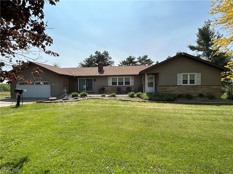 Three-bedroom ranch home with attached two-car garage situated in a 1.3-acre lot.  Eat in kitchen with all appliances remaining for a new owner to enjoy.
Large family room with fireplace.   Full basement.  The home is well-maintained.   Additional lot available to be purchased.  Seller will escrow $20,000 to repair or replace septic system as per Trumbull County requirements.