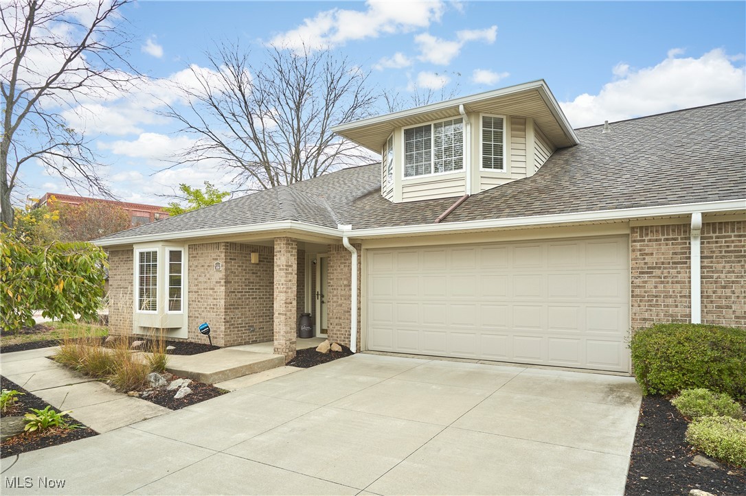 Classy brick condo with 1st floor living in downtown Akron’s premier Townhomes at Canal Park association! Featuring a two-story living room & dining area w/ wall of windows allowing for abundant natural light, living room with gas fp & door to private paver patio, cozy kitchen w/ granite counters, gas range & breakfast bar, master suite w/ WIC & full bath, additional guest bedroom and full bath, and laundry room w/ washer & dryer that stay! This condo also has a 2nd floor loft that would make great office space, w/ a WIC for extra storage, and plumbing for adding another bath. Maintenance free living plus a 2 car attached garage w/ added shelving! Conveniently located < .25 mi from the Ohio & Erie Canal Towpath Trail & Canal Park!