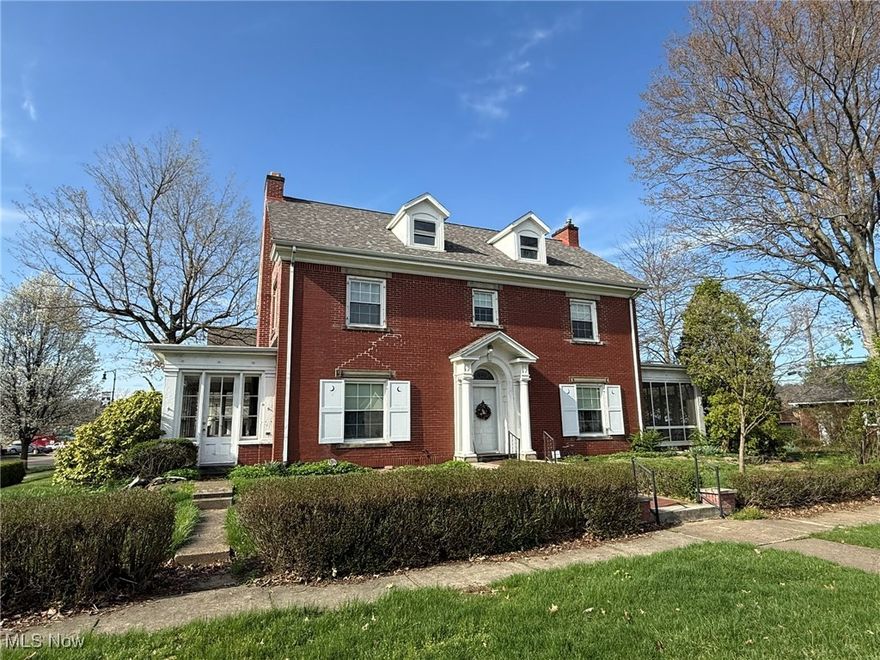 Stately brick home with 4 bedrooms, 2 full baths.  Historic Brakebill home is eligible for historic registry and includes unique features.   Original woodwork throughout with beautiful hardwood floors.  Fresh paint throughout.  Spacious entry foyer.  Decorative fireplace in the living room with crown molding and 2 sets of French doors to the sun room with brick fireplace.  New white Kraftmaid kitchen with Quartz counters, tile backsplash, stainless steel sink includes brand new range, refrigerator, and microwave.  French doors lead to the formal dining room and screen enclosed back porch.  Built in cabinets in the second floor foyer.  Master bedroom includes access to the office.  Beautifully updated 2nd floor bathroom features walk in shower and ceramic tile floors.  Finished walk up attic with 4th bedroom.  Vinyl replacement windows throughout the second and third floor.  2 car brick detached garage.  Motivated seller!