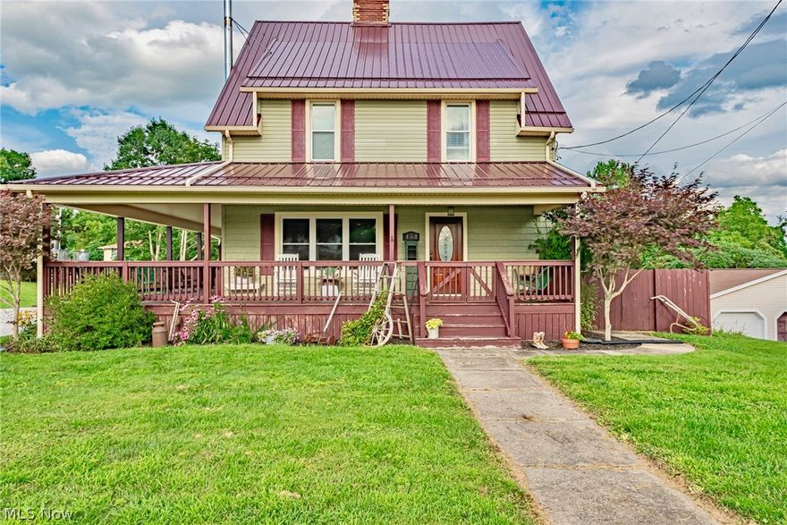 Fall in love with this completely renovated, beautiful colonial home! Enter and experience a new farmhouse style interior that is flooded with light but still holds some of the original charm throughout the 4 BR/2 BA home!  Take notice to the details as you travel through this proudly maintained home that features original sliding pocket doors, French doors, 8” baseboards, and stunning original fireplace with electric insert.  Arrive from the covered wrap-around front porch into the spacious living room with an inviting fireplace and hardwood floors that leads you through the sliding pocket doors to a one of a kind kitchen.  This tastefully updated kitchen offers custom Craft Maid cabinetry, attractive granite countertops with kitchen island, Copper farmhouse sink, and French doors that lead you to the other side of your covered porch for any of your entertaining requirements.  Your checklist is complete on the main level with a 1st floor laundry room that directs you to private fully