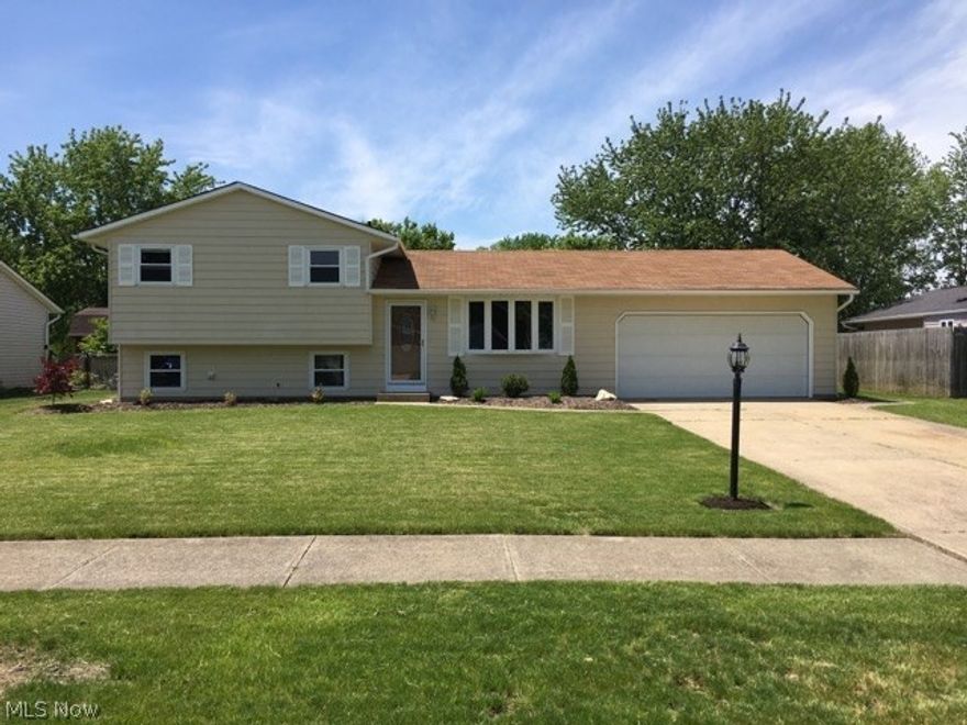 Spacious 3 Bedroom 2 Bath Split Located On A Quiet Street in North Ridgeville * Beautifully Updated & Upgraded Throughout * New Kitchen With Ceramic Tile Flooring, Granite Counters And New Stainless Steel Appliances * Living Room With Crown Molding And A Bow Window * Spacious Family Room Great For Entertaining * Large Laundry Room * Updated Bathrooms * Nice Backyard With A Patio And Storage Shed * Oversized 20x26 Attached Garage * Newer Kitchen, Bathrooms, Interior & Exterior Doors, Tile Flooring, Carpet, Paint, Trim Work, Light Fixtures, And Faucets * This Is The True Meaning Of Move In Condition * Do Not Miss Your Opportunity To Own This Home * Call Today To Schedule Your Private Showing * Immediate Possession
