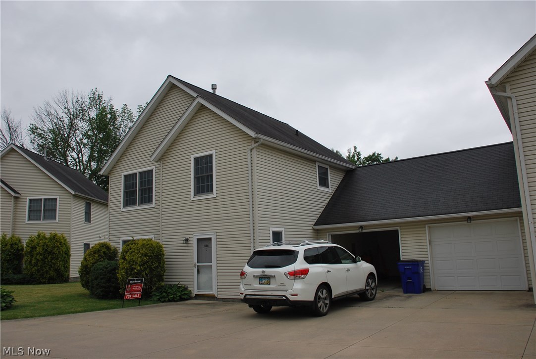 Awesome condominium w/ attached garage, windows in every room (except bathrooms & utility room of course!)! GREAT Location close to the University Hospital complex in Ravenna, easy access to Turnpike I-80 & Interstate I-76! Easy drive to the University Northeast Ohio College of Medicine and Kent State University as well as University of Akron & Akron Hospitals! This 2 bedroom PLUS LOFT unit was just built in 2000 & has been freshly painted, new carpet & laminate flooring on entire 1st floor! Furnace has easy access located on the 1st floor along w/ the new hot water tank! Attached garage w/ electric opener & keypad entry leads into the kitchen & half bath hall for easy accessibility with groceries as well as a great safety feature! Entry has a huge double closet for lots of coats & storage along w/ an additional storage closet under the steps & in the utility room. The laundry washer & dryer are located in a double closet off the kitchen for ease of use & the fully appliance kitchen ha