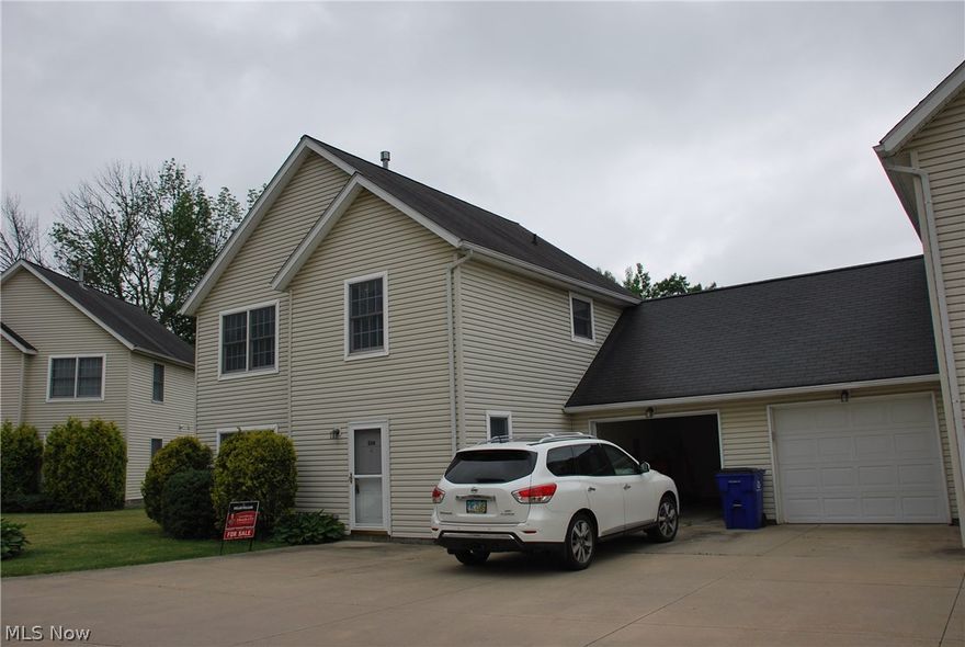 Awesome condominium w/ attached garage, windows in every room (except bathrooms & utility room of course!)! GREAT Location close to the University Hospital complex in Ravenna, easy access to Turnpike I-80 & Interstate I-76! Easy drive to the University Northeast Ohio College of Medicine and Kent State University as well as University of Akron & Akron Hospitals! This 2 bedroom PLUS LOFT unit was just built in 2000 & has been freshly painted, new carpet & laminate flooring on entire 1st floor! Furnace has easy access located on the 1st floor along w/ the new hot water tank! Attached garage w/ electric opener & keypad entry leads into the kitchen & half bath hall for easy accessibility with groceries as well as a great safety feature! Entry has a huge double closet for lots of coats & storage along w/ an additional storage closet under the steps & in the utility room. The laundry washer & dryer are located in a double closet off the kitchen for ease of use & the fully appliance kitchen ha