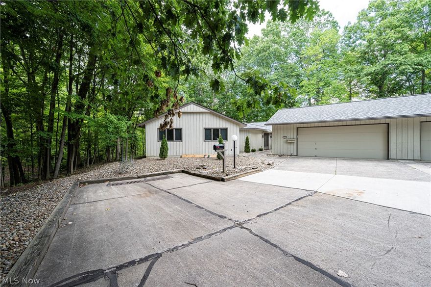 STUNNING renovated RANCH on a private street which borders the METROPARKS.  Come live amongst the trees in this secluded END UNIT, which is one with nature. The abundance of natural light gleams off the new flooring throughout this over 2800 sq foot unit.  The kitchen features granite countertops, stainless steel appliances, soft close cabinets, huge center island, and a breakfast bar.  The kitchen is open to the living/dining room and connects to the Sunroom with walls of glass.  The Master bedroom has two walk-in closets and a new master bath with steam shower.  There are three additional bedrooms and another full and half bath.  The office and laundry room complete this very special property.  Two car attached garage.  Come enjoy all the amenities that LEDGEWOOD has to offer. Pool, tennis courts, clubs house and more.  Come Quickly!