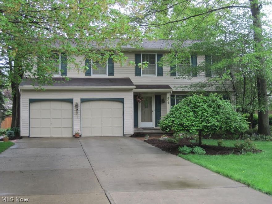 Looking for perfect?  You have found it. Four bedroom vinyl sided 2.5 bath home situated on a pristine wooded lot.  Fantastic landscaping, brick walkways, deck and patio are just the beginning.  Enter to a meticulously maintained home.  Formal living room and dining room.  L-shaped kitchen completely remodeled, lots of cupboards, island with Jenn Air and beautiful eating area.  The family room is nicely appointed with fireplace (wooded or gas) and Pella windows with internal blinds.  Upstairs features master suite, three additional bedrooms, and second-floor laundry room.  Full basement with Rec-Room.  Call today for a private showing.