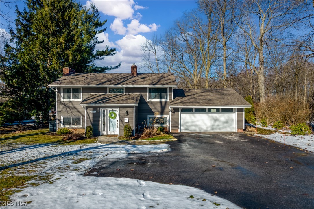 Welcome home to this charming bi-level gem in the highly sought-after city of Highland Heights, celebrated for its picturesque surroundings and outstanding schools, including the esteemed Mayfield School System. This delightful property isn’t just a house; it’s a lifestyle waiting to be embraced! As you step inside, you’re welcomed by a lovely foyer featuring elegant ceramic tile and two spacious closets, perfect for all your seasonal essentials. The heart of the home is truly remarkable, boasting a stunning English garden-level walkout that seamlessly connects the dining room, kitchen, and family room. Imagine hosting gatherings in the cozy family room, warmed by a wood-burning fireplace, or enjoying intimate dinners in the beautifully updated dining space. The kitchen is a culinary dream, fully renovated in 2020 with chic white cabinets, gleaming quartz countertops, and sleek stainless steel appliances that make cooking a delight. New vinyl plank flooring flows gracefully from the kitchen to the dining room, creating a modern aesthetic. Retreat to the newly carpeted living room, an ideal spot to unwind after a long day. The remodeled upstairs bathroom, completed in 2017, ensures both style and functionality are at your fingertips. Updates throughout the home include new vinyl siding and a garage door system in 2019, along with freshly painted interiors—beautifully marrying modern comforts with timeless charm.
Step outside to your private oasis, perfect for summer barbecues and serene evenings under the stars. The newly paved driveway, completed in 2020, enhances curb appeal and functionality. With vital updates such as a new A/C unit in 2019, a reliable furnace from 2011, and a roof replaced in 2007 (with part replaced in 2024), this home is both beautiful and well-maintained. Don’t miss your chance to make this stunning home your own and enjoy all the wonderful amenities this vibrant community has to offer!