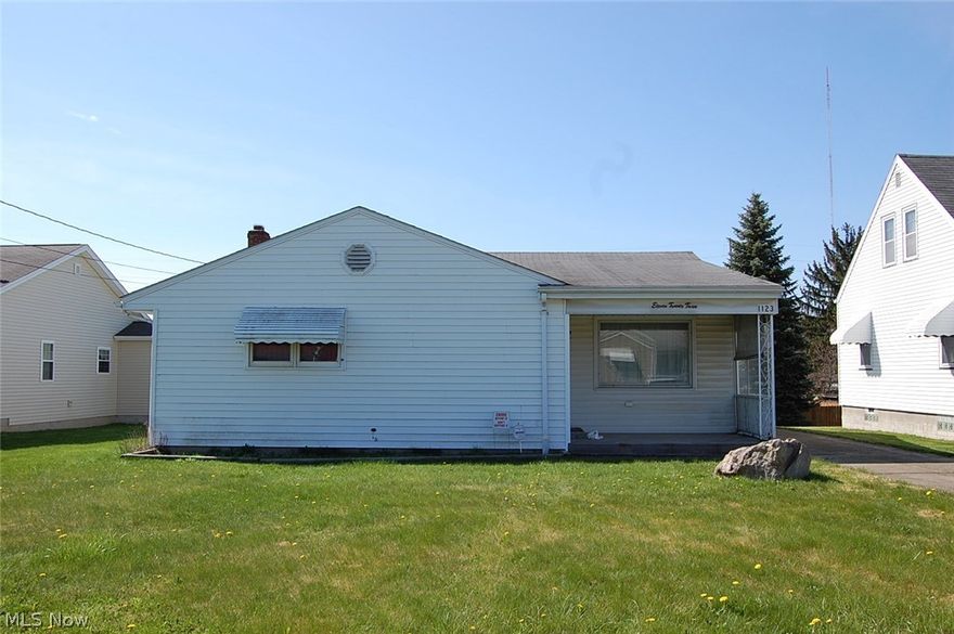 This home has vinyl siding and a large 2 and 1/2 car detached garage. Needs some updating