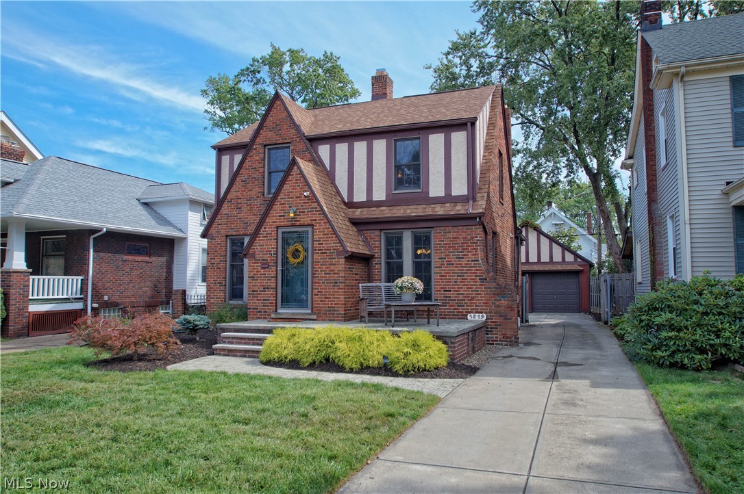 Pride of ownership shines throughout this gorgeously maintained, brick colonial on one of Lakewood's most desirable streets. Remodeled and redesigned kitchen is ideal for the chef of the family includes newer stainless appliances, granite countertops and an open concept to the formal eating area. Old world charm is apparent in the living room with fireplace. Three generously sized bedrooms and remodeled full bathroom are featured upstairs. Second floor deck overlooks the pristinely maintained, private, fenced yard with lovely stamped concrete patio. Finished basement adds a rare second living area that is great for entertaining. Beautiful hardwood floors throughout the first and second levels highlight the original historical elegance. Updates include roof replacement, both bathrooms, basement finishing and waterproofing, newer Andersen windows, hot water heater, and stamped concrete patio. Two car detached garage includes a walk-up attic with an abundance of storage. Ideal location al