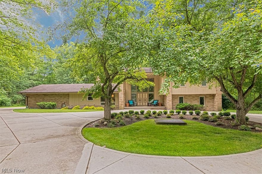 Simply stunning, this contemporary style split-level is ready for a new owner. With over 4,000 sq. ft. of living space, an open floor plan, and a fantastic master bedroom suite, all it needs is you! Step down into the expansive great room, which features a tray ceiling, a corner bar, and a wall of windows framing the gorgeous natural setting. The vaulted dining room is open to the great room and flows into the kitchen. The eat-in kitchen showcases dark granite counters, stainless steel appliances, and a center island. Off of the great room, there is a lovely family room and a bedroom suite that is currently set up as an office. A half bathroom and a laundry room that connects to the garage complete the first floor. Upstairs, there are three spacious bedrooms each with its own en-suite bath, including the fabulous vaulted master bedroom suite. The lower level is partially finished with a recreation room or office, a full bathroom, and your own private sauna, perfect for relaxing after a