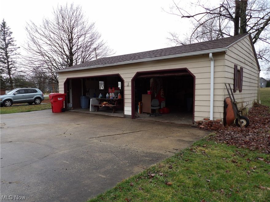 Howland Schools. Cozy 2, possibly 3 bedroom situated on a a little over 1/2 acre corner lot. 3 car garage provides ample room for cars and lawn equipment. All appliances remain (Stove, Refrig, washer & dryer) Has central air for those hot summer days. Formal dining room.
Upstairs area could be used for game room or spare bedroom. Basement area walls are covered with beautiful old barn siding making a great computer or family room.  Owner is Ohio licensed Realtor.