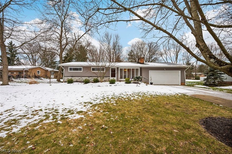 Here’s the Brecksville ranch you’ve been waiting for! 4 bedrooms, 2 full baths, and loads of upgrades and amenities really make this one special!  Enter the spacious living room topped by a dramatic center beam, and your eye is initially drawn to the stone hearth. On second glance, you spy the extra large deck and fenced yard through the dining room windows and doorway. Hardwood floors throughout! Lovely kitchen showcases very recent appliances and opens directly to family room.  The family room features matching ceiling beam, shiplap focal wall and sliders directly to deck. All four bedrooms have sliding closet doors.  Both bathrooms were updated, giving everything a fresh and contemporary look. Lower level features include laundry and storage area, large fun playroom with wall murals, and media room with projector and screen (included!). 2 car attached garage leads straight to the mud room, a necessity in the NE Ohio climate! New siding and fence wrap around the entire house, and sho